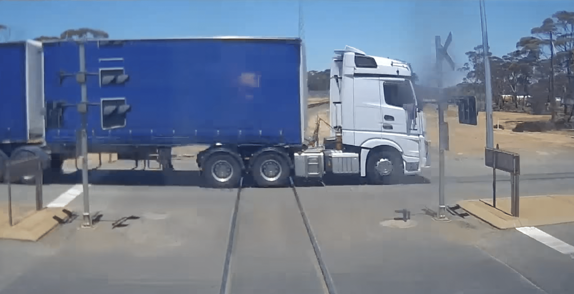 Heart-stopping video of near miss between truck and train prompts calls ...